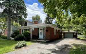 Brick bungalow with driveway and garage